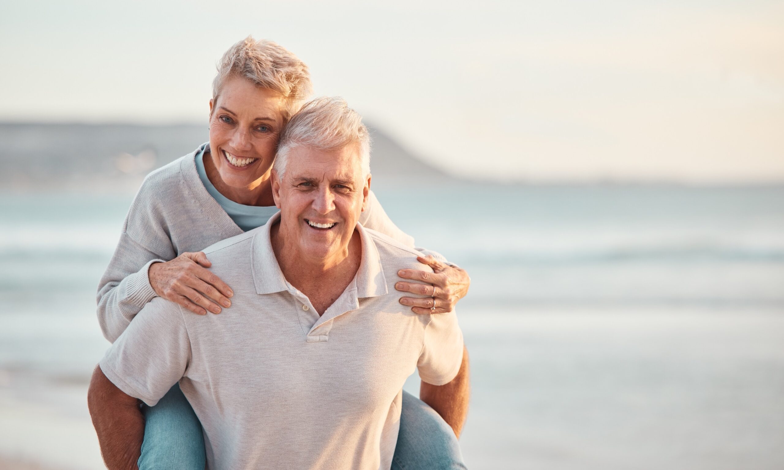 Senior couple laughing together outdoors