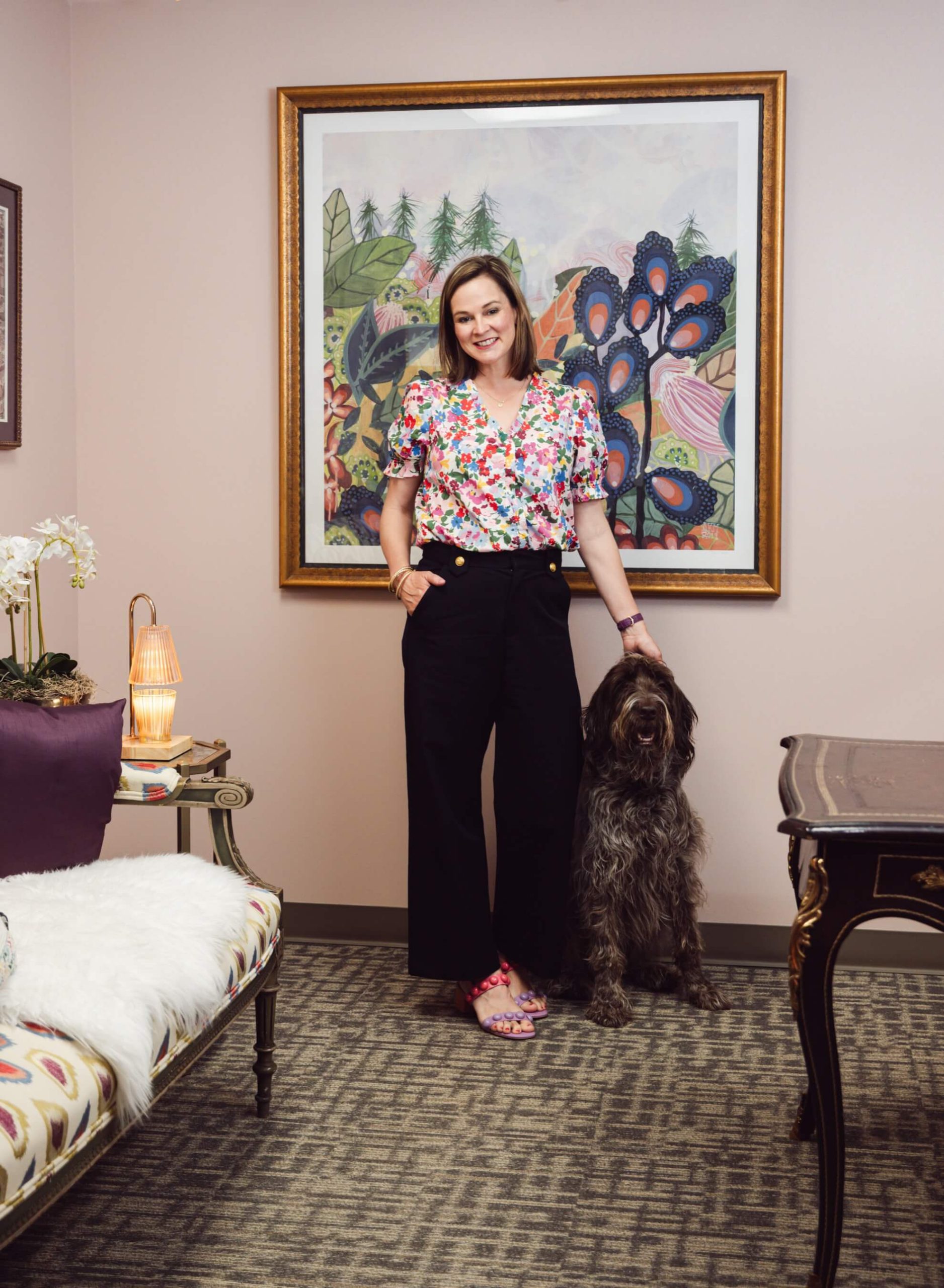 Dr. Susanna Ringeman standing with Bingo, the practice mascot