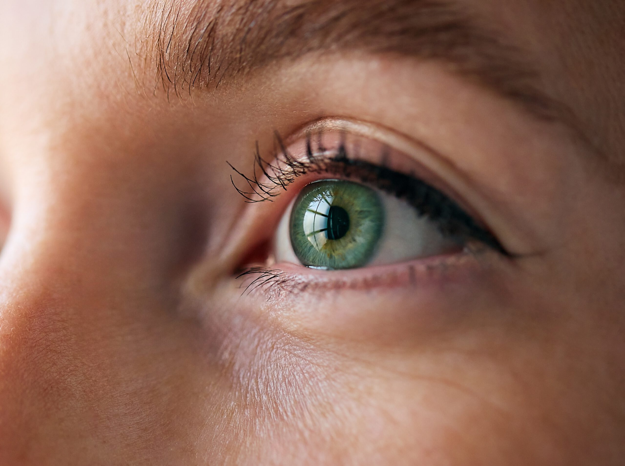 Close-up of a woman's eye showing the iris and pupil