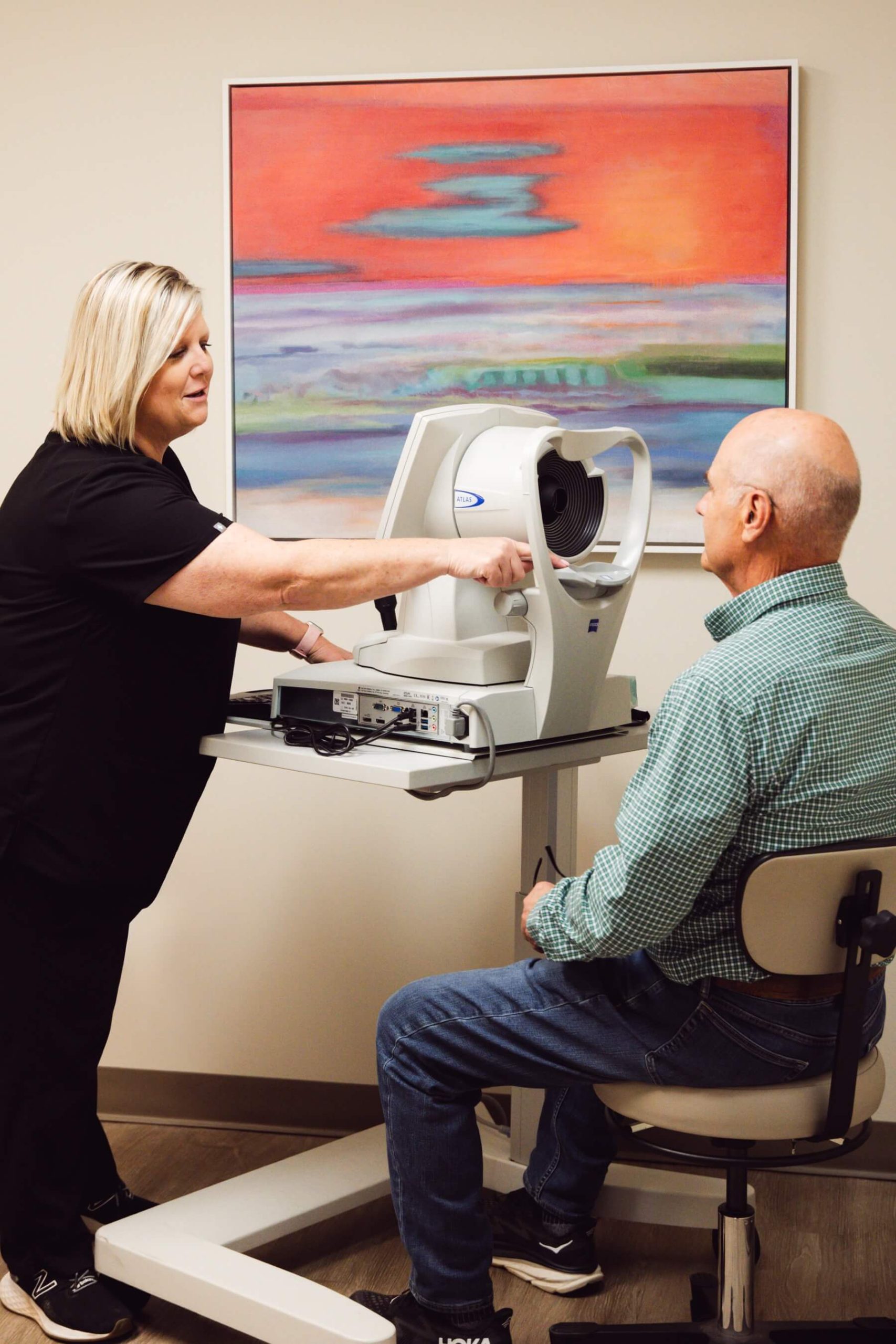 Forsyth Eye Health technician performing retinal imaging on a patient