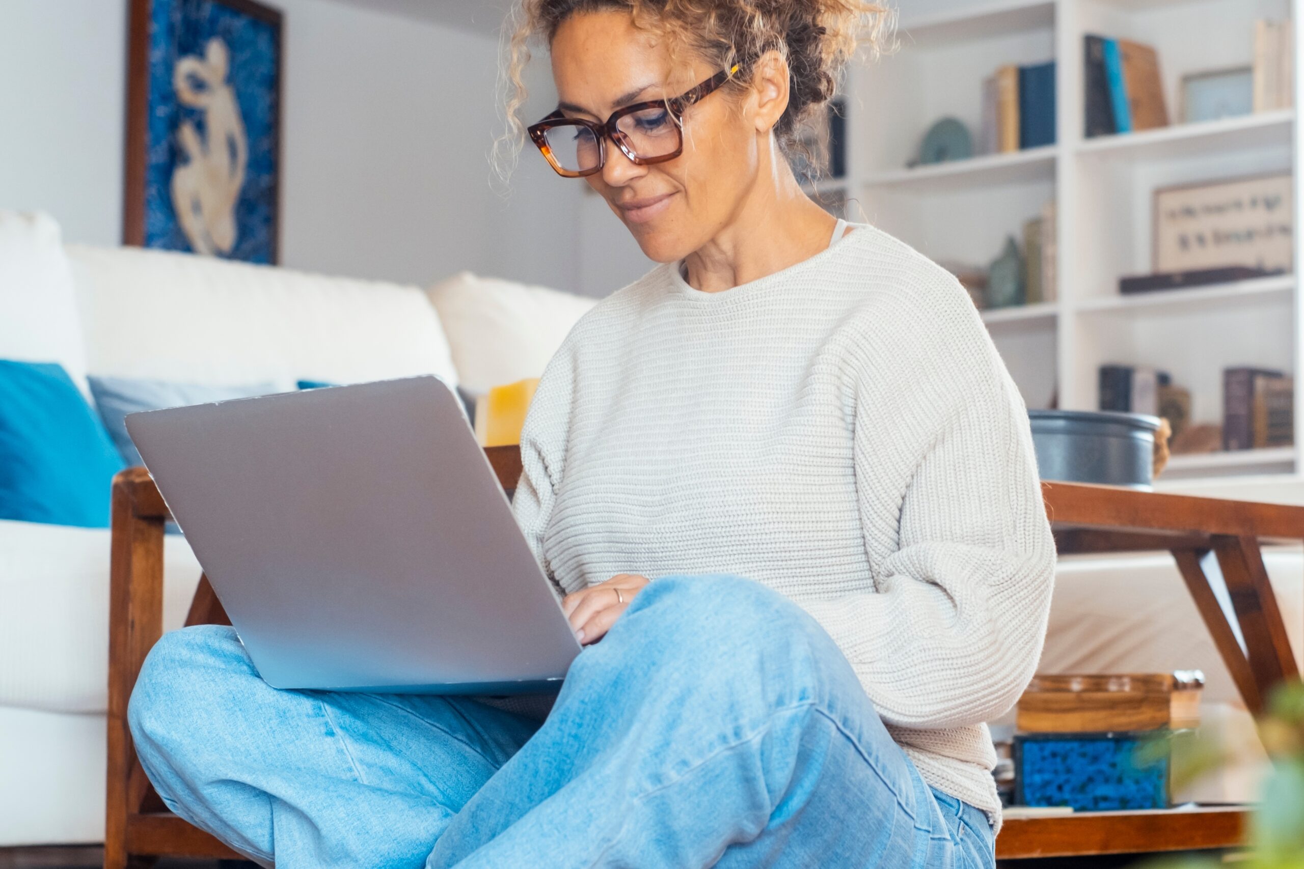 Woman working on a laptop at home